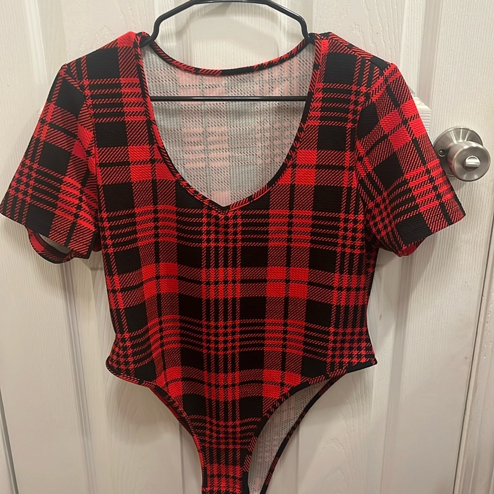 Black and red short-sleeve body suit. Three snap buttons at bottom. Worn 1x